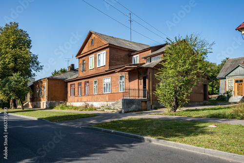 Fototapeta Naklejka Na Ścianę i Meble -  example of hundred-year-old historical old wooden building and homestead of private sector in wooden constructivism style