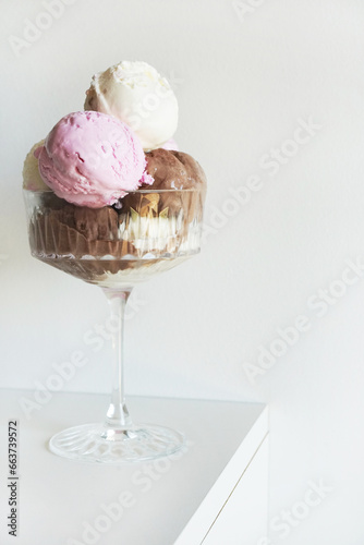 Wallpaper Mural Vanilla, chocolate and strawberry ice cream scoops in glass on white background Torontodigital.ca
