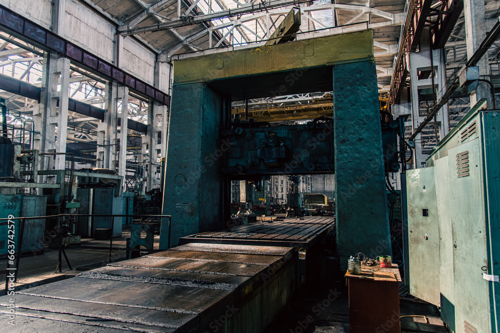 Old equipment, machines, tools in a rustic style in an abandoned mechanical factory Old equipment, machines, tools in a rustic style in an abandoned mechanical factory