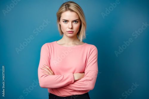 Woman with her arms crossed posing for picture.