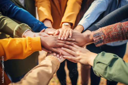 Group of mix race people joining hands together in a circle supporting each other  symbolizing unity and collective action in the fight against social injustice
