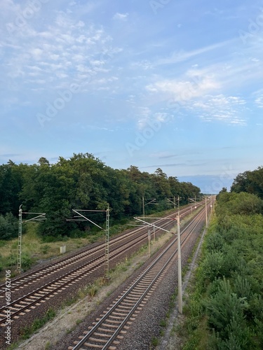 Empty railways in countryside, cloudy sky