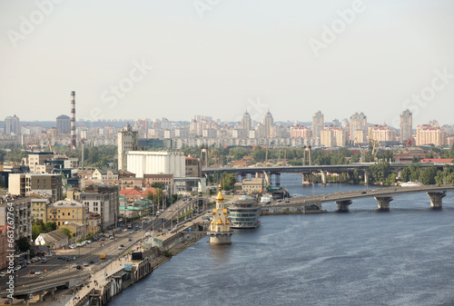 Panorama of the city of Kyiv from a bird's eye view. View of Podol from the south of the city of Kyiv in Ukraine. Industrial and historical center on the banks of the Dnieper River