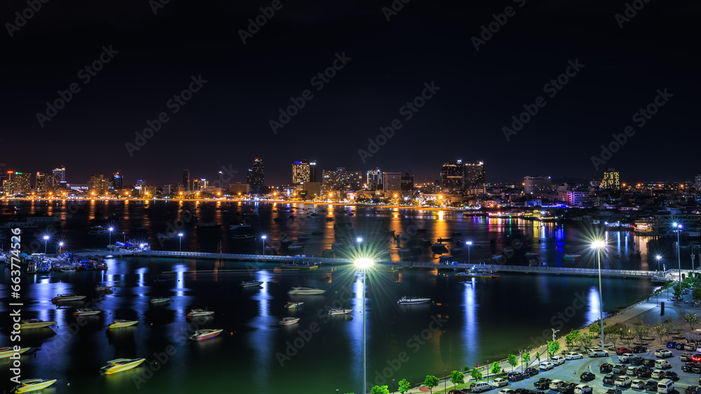 Skyscrapers and Pattaya Bay in the night over lighting, Pattaya city is famous for sea sport and night life entertainment, Chonburi Province Thailand, Laem Bali Hai view point,