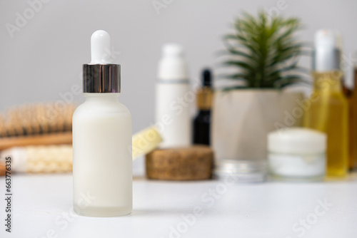 Natural herbal eco cosmetics - cream or serum in a glass jar with a pipette dispenser