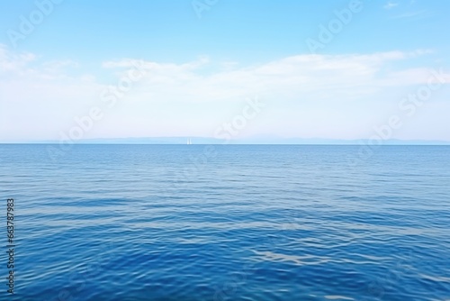 shot of a calm sea with horizon and wind turbines © altitudevisual