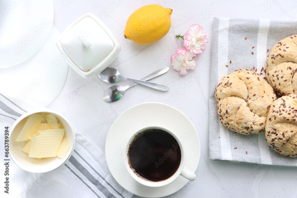 Breakfast with fresh rolls and coffee. on a white background. Morning Breakfast with fresh rolls and coffee. on a white background. Morning