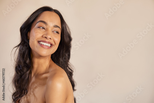 Beautiful young woman laughing after beauty treatment at spa