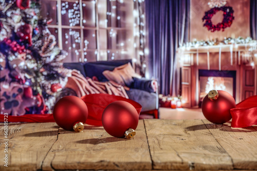 Desk of free space and christmas balls decoration. Home interior with fireplace and christmas tree. 