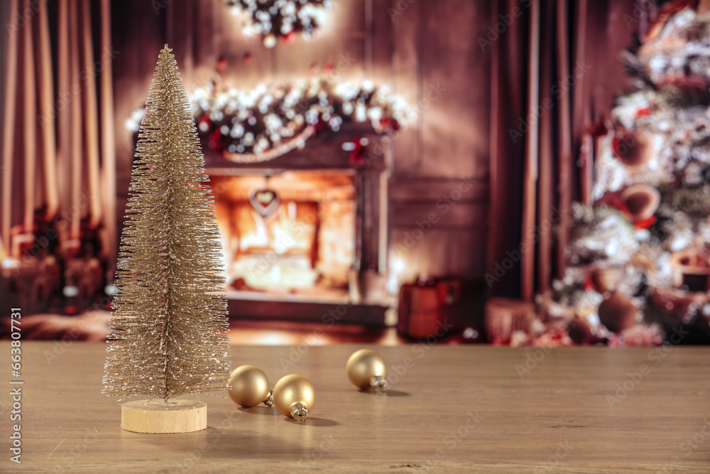Obraz premium Desk of free space and christmas balls decoration. Home interior with fireplace and christmas tree. 