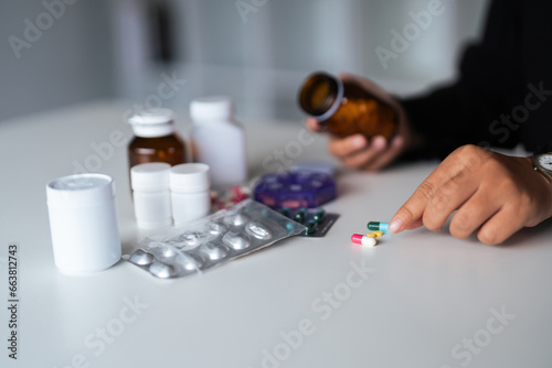 Close up woman holding pill in hand with water feeling sick. female going to take painkiller from headache, painkiller, healthcare, medicine, treatment, therapy, patient, disease illness concept