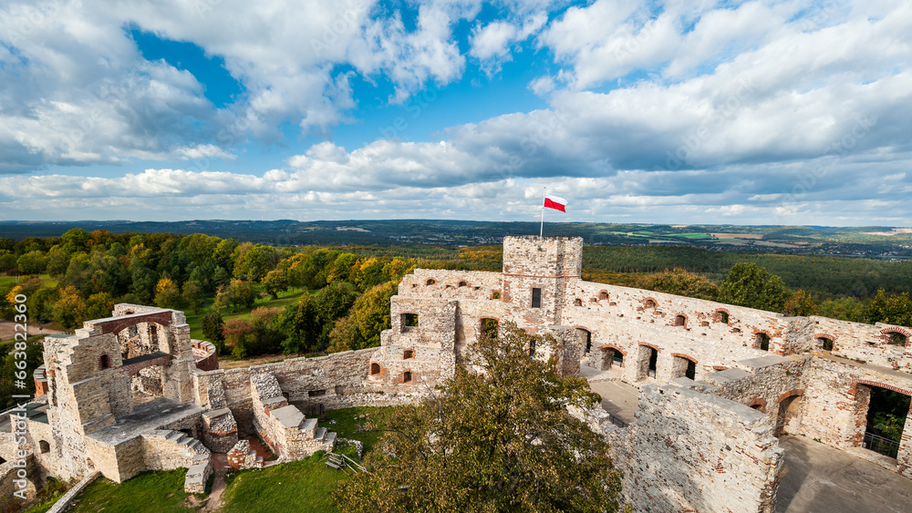 Tenczyn Castle in Rudno on the Trail of the Eagles' Nests. A beautifully situated fortress. Polish flag. Kraków-Częstochowa Upland. Poland
