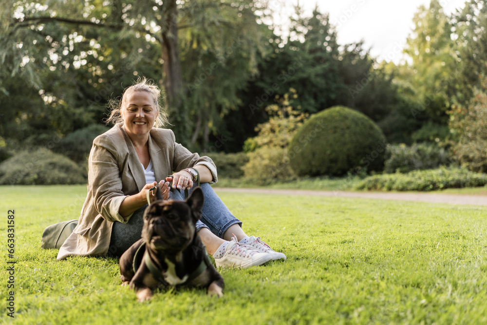 Blonde girl of forty years old cuddles with her dog Blonde girl of forty years old cuddles with her dog