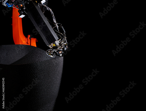 3D Drucker (Extruder) gelagert auf einem Roboter-Arm für die Produktion großer Drucke aus Kunststoff photo