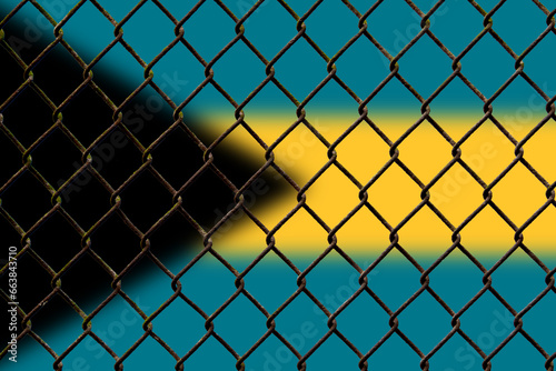 A steel mesh against the background of the flag Bahamas.