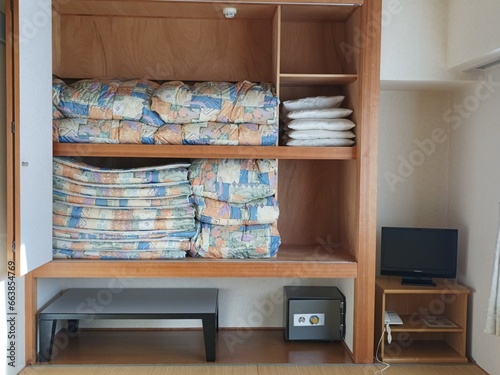 Japanese-style room and folded futon, Japanese hotel.