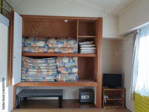 Japanese-style room and folded futon, Japanese hotel.