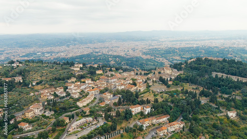 Florence, Italy. Fiesole is a city in the Tuscany region, in the province of Florence. The city of Florence in the background of the panorama, Aerial View photo