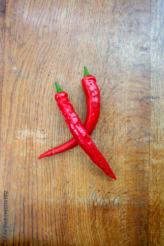 Red chillies on a wooden chopping board