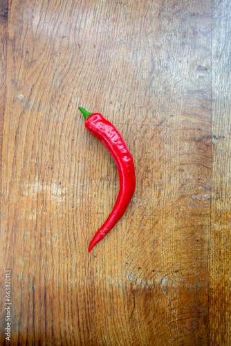 Red chillies on a wooden chopping board