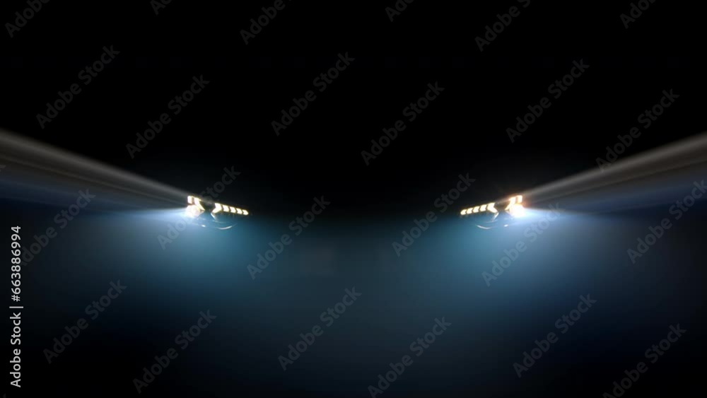 Close-up of an anonymous car's blinking headlights against a dark background in foggy lighting. Auto advertising concept, speed and lights.