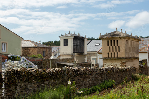 Peaceful Village with Traditional Stone Houses Under a Blue Sky
