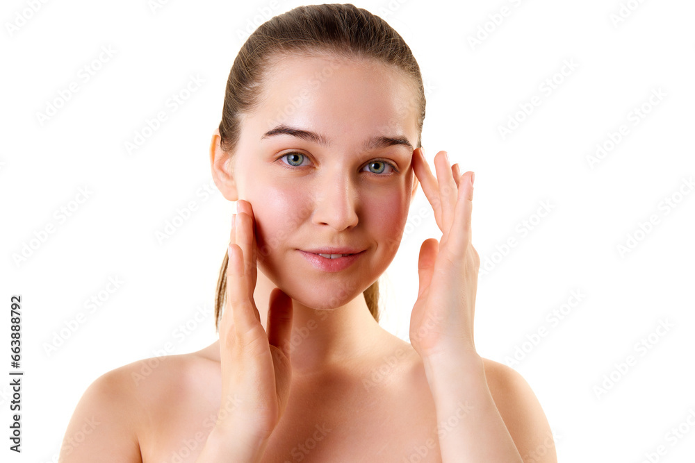 Good looking young smiling woman with bare shoulders looking at camera touching her face. Skincare cosmetic treatment affect. Skincare routine. Good looking young smiling woman with bare shoulders looking at camera touching her face. Skincare cosmetic treatment affect. Skincare routine.