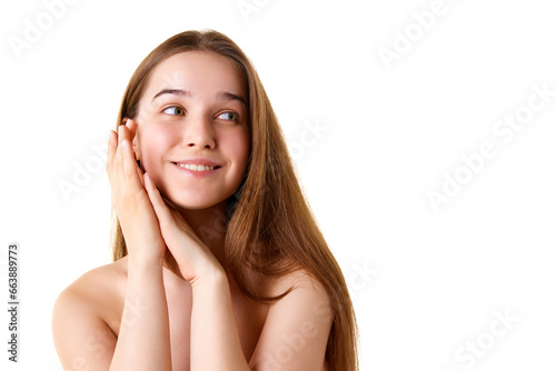 Portrait of charming brunette girl smiling and enjoying beauty treatment looking away against white studio background. Copy space