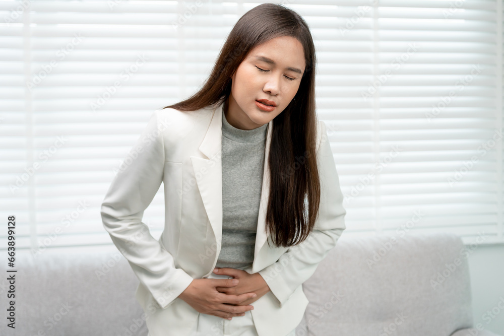stomach ache. Asian women have abdominal pain, indigestion, gastritis, menstrual cramps, flatulence, diarrhea, distention, colon cancer, belly inflammation problem, suffer food poisoning, abdomen.