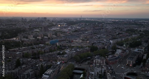 Wallpaper Mural Night time aerial drone view of Amsterdam West, city center. Right after sunset. Urban housing and skyline. Torontodigital.ca