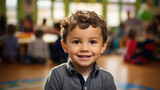 Little preschooler in the background of a classroom