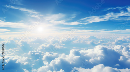 Aerial photography capturing a serene blue sky and its majestic cloud formations from above. Perfect for showcasing the tranquility of nature.