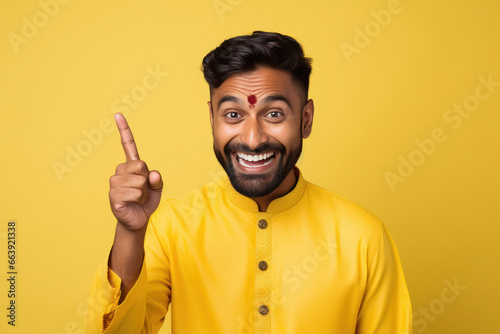 indian man smiling and showing finger in front side