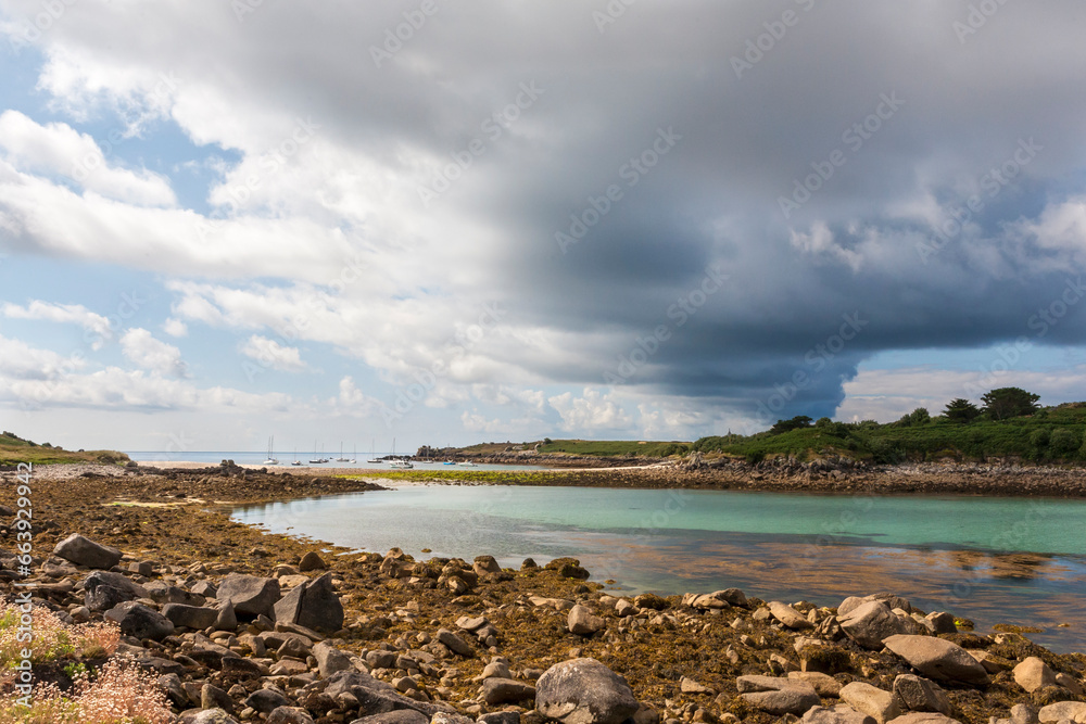 Dramatic cloudscape over the sandspit known as Gugh Bar, between St. Agnes and Gugh, Isles of Scilly, Cornwall, England, UK