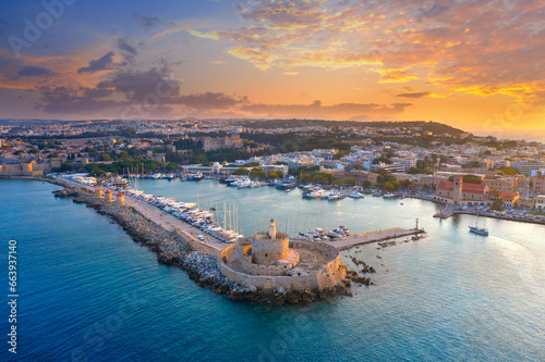 Mandraki port with deers statue, where The Colossus was standing and fort of St. Nicholas. Rhodes, Greece.  photo