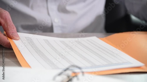Hand of businessman opening a folder