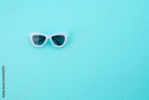 A stylish pair of sunglasses on a vibrant blue background
