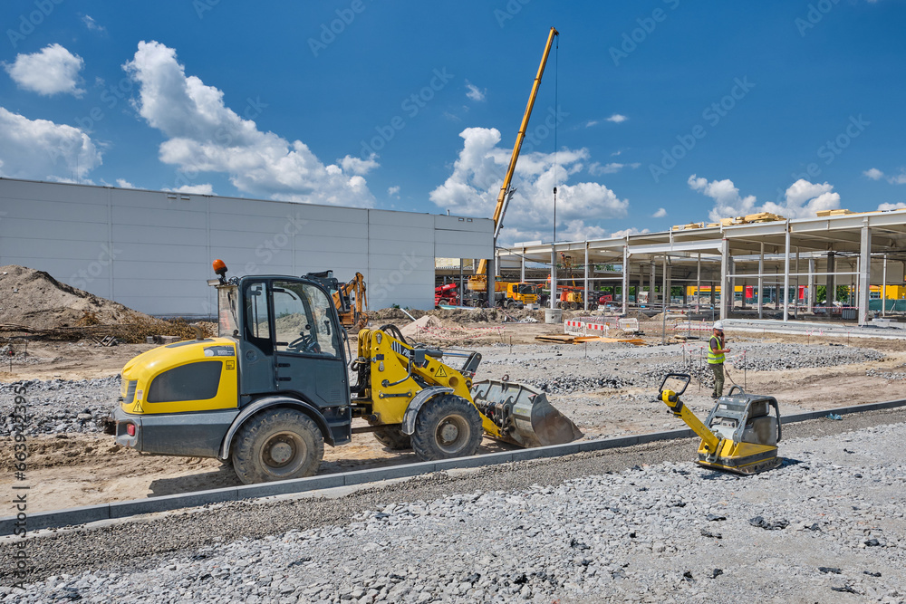 bulldozer and other construction equipment in front of construction site building modern gallery mall bulldozer and other construction equipment in front of construction site building modern gallery mall