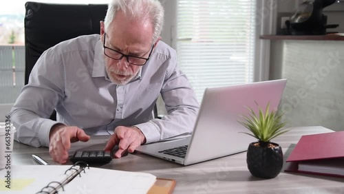 Portrait of an angry businessman working at office