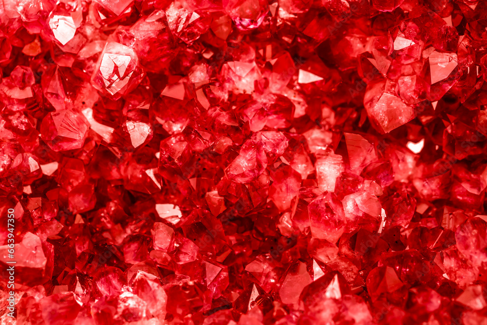 Amethyst red crystals. Gems. Mineral crystals in the natural environment. Texture of precious and semiprecious stones. Seamless background with copy space colored shiny surface of precious stones.