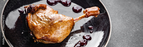 duck leg confit berry sauce poultry meat eating cooking meal food snack on the table copy space food background rustic top view photo