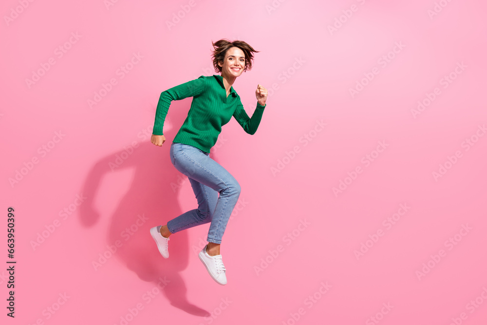 Full body photo of jumping air running girl wear trendy garment catch best offer customer shopaholic isolated on pink color background