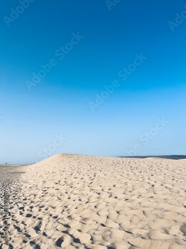 Sandy ocean dunes and blue sky