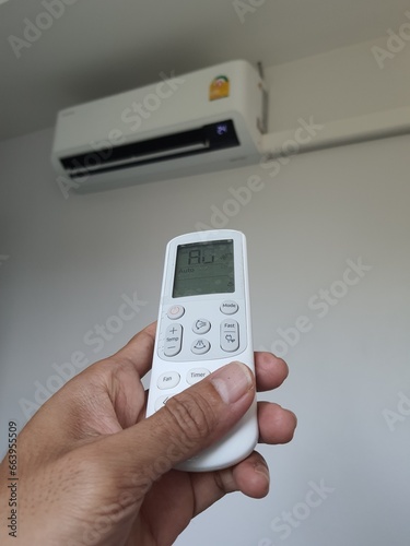 The picture shows how to use the air conditioner remote control.