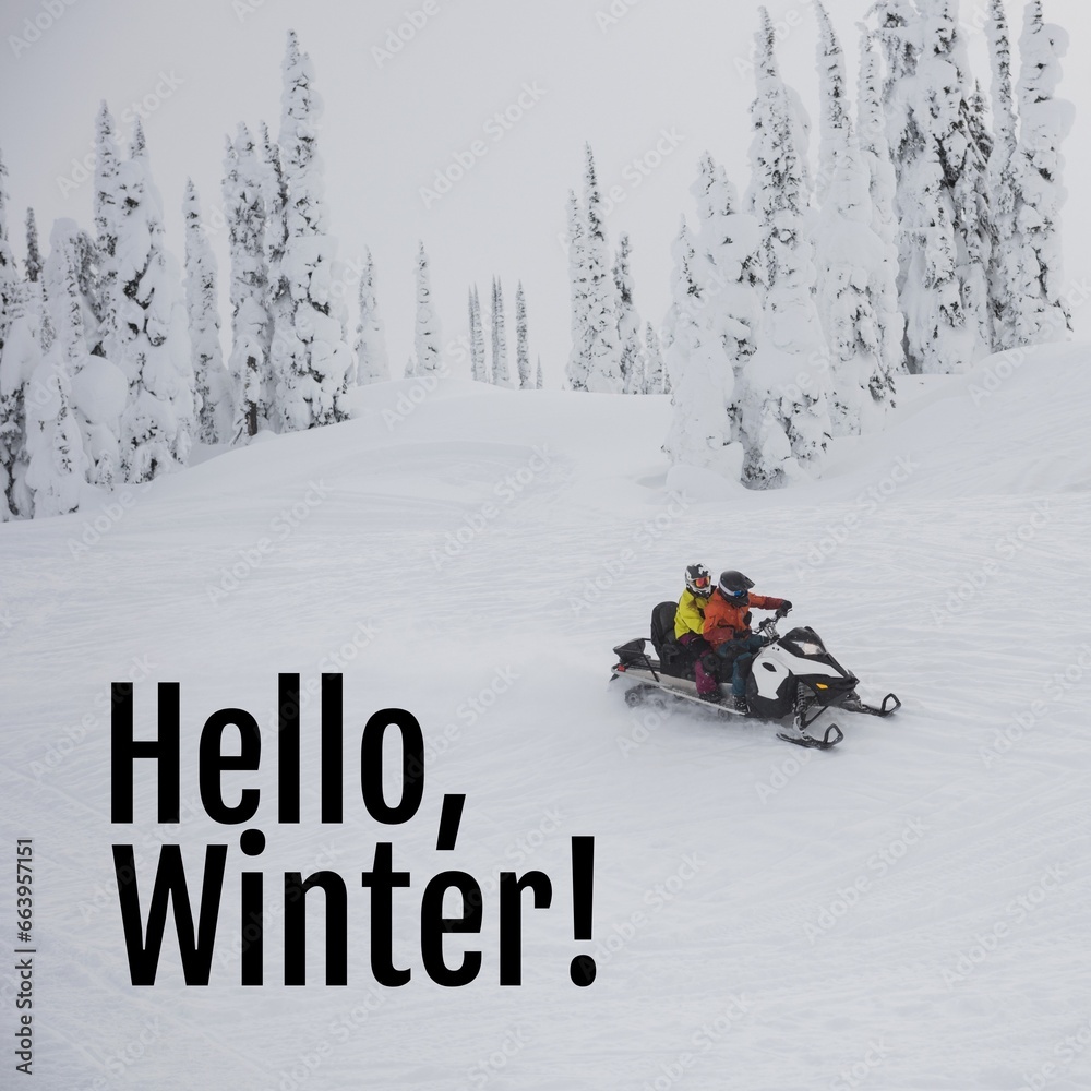 Composite of hello winter text over caucasian couple in snow scooter in winter scenery