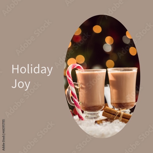 Composite of holiday joy text over two glasses of hot chocolate