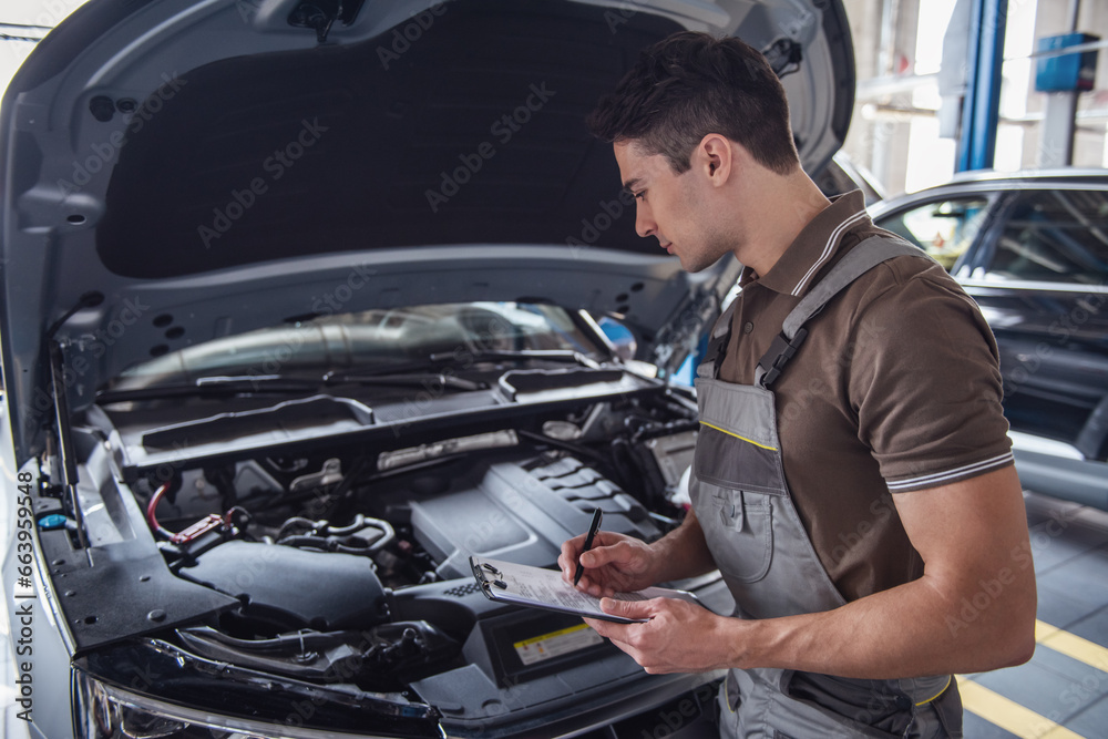 Handsome auto service worker Handsome auto service worker