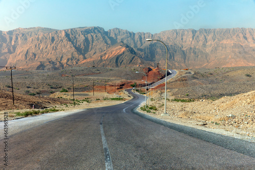 Highway along high lifeless mountains in Oman