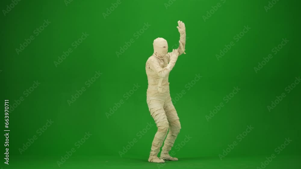 Green screen isolated chroma key video capturing a mummy dancing with hands up. Mock up, workspace for your promotion clip or advertisement. Full length. Half turn. Green screen isolated chroma key video capturing a mummy dancing with hands up. Mock up, workspace for your promotion clip or advertisement. Full length. Half turn.