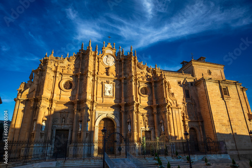 Wide view of the baroque facade of Guadix Cathedral  Granada  Andalusia  Spain  with beautiful morning light